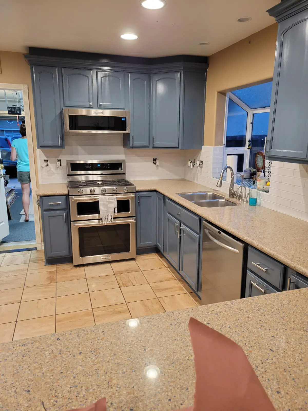 Kitchen cabinets refinished in a deep blue colour