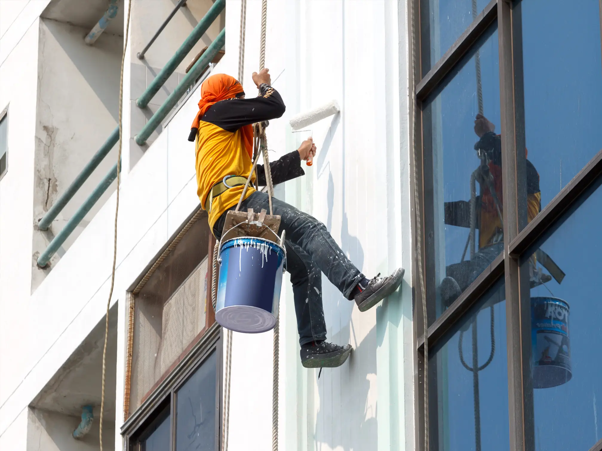 Commercial painter applying an exterior coating